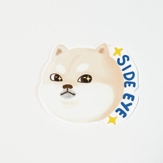 A die-cut sticker featuring a winking Shiba Inu dog face with the words 'SIDE EYE' in blue and yellow stars, shown on a plain white background.